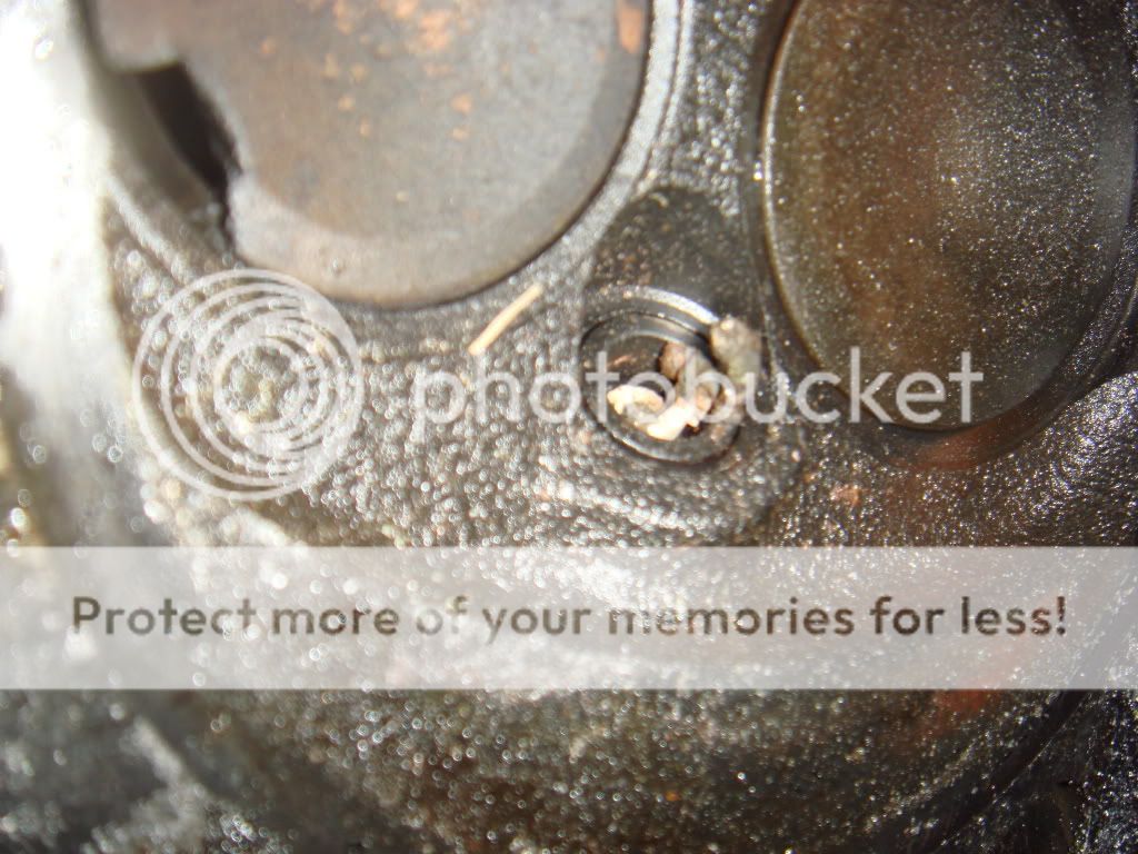 thought i had bad head gasket now i find broken valve as well Taurus